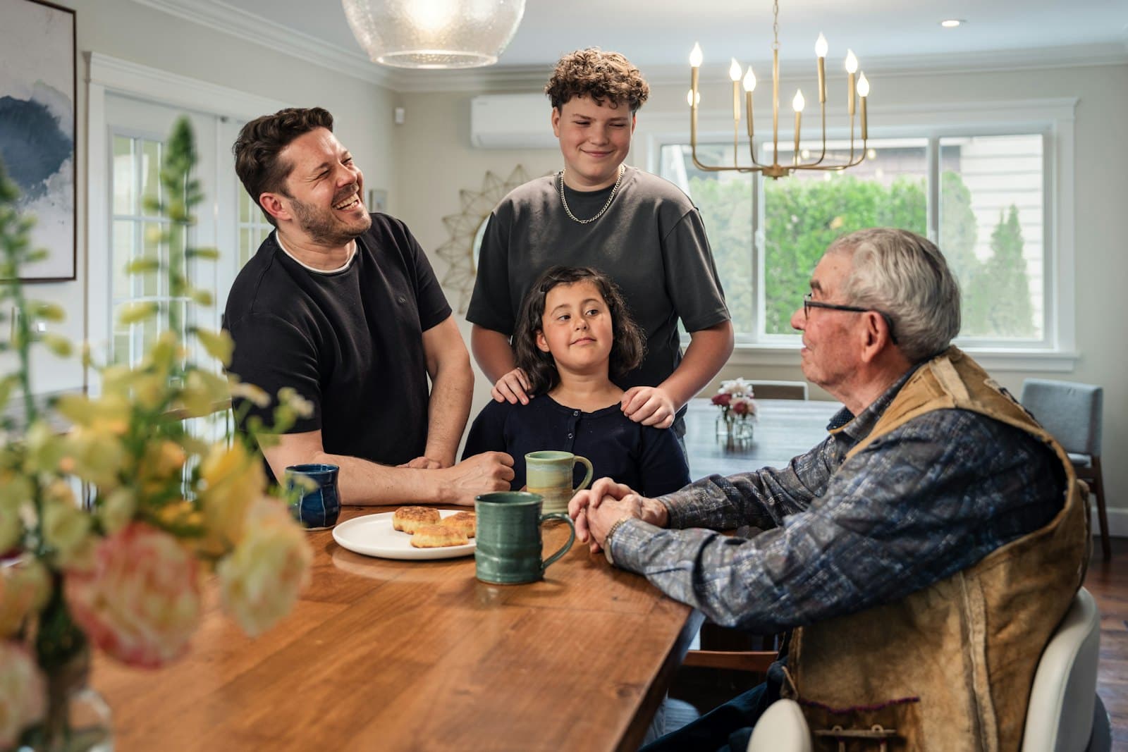 Three generations of a family around the dinner table