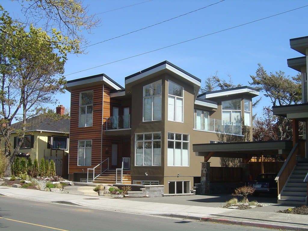 Modern two-storey homes on a sunny residential street in Victoria, BC